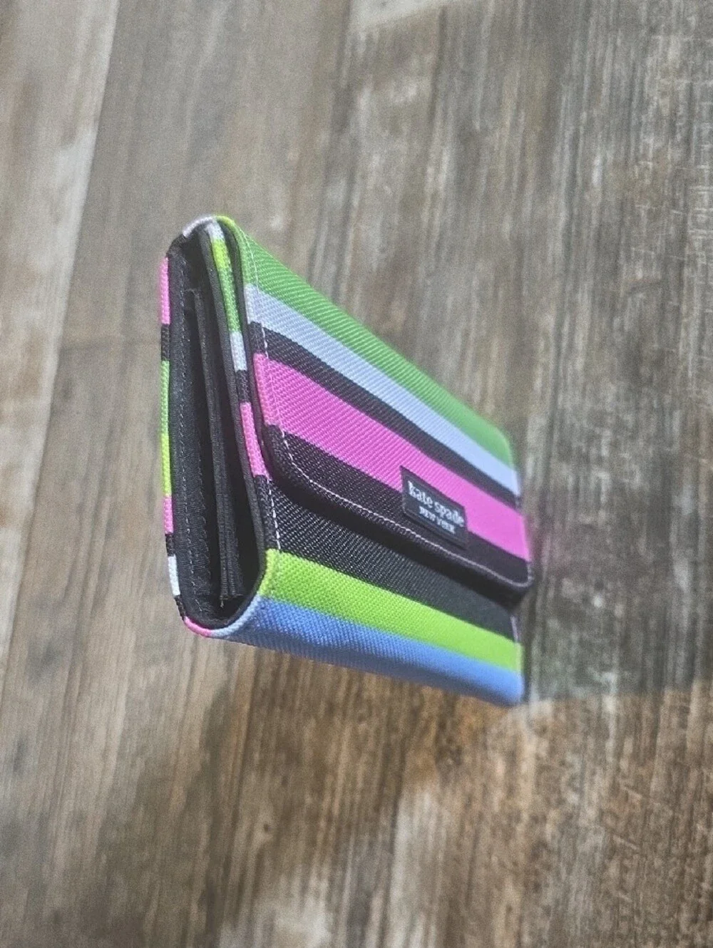 kate spade striped trifold wallet in lime green, hot pink, black, white, blue